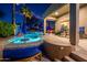 Captivating backyard oasis with a sparkling pool, bench seating, patio, and lush desert landscape at 19644 N Majestic Vista Ct, Surprise, AZ 85387
