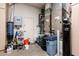 Utility room with storage cabinets, water filter and a newer model Bryant HVAC system at 19644 N Majestic Vista Ct, Surprise, AZ 85387