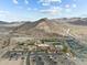 Community aerial view featuring a pool, parking, tennis courts, and mountain views at 20721 W Fern Dr, Buckeye, AZ 85396