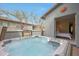 Backyard with a hot tub and entrance into the main bedroom at 20721 W Fern Dr, Buckeye, AZ 85396