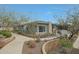 Charming single-story home featuring stone accents, desert landscaping, and a private walkway at 20721 W Fern Dr, Buckeye, AZ 85396