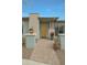 Front porch featuring brick pavers, decorative plants, and a colorful front door that enhances the entrance at 20721 W Fern Dr, Buckeye, AZ 85396