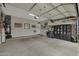 Organized garage with ample storage, wall decor, and space for vehicles and equipment at 20721 W Fern Dr, Buckeye, AZ 85396