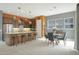 Open concept kitchen with an island, stainless appliances, pendant lights and adjacent dining area at 20721 W Fern Dr, Buckeye, AZ 85396