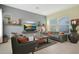 Well-lit living space with comfortable seating, modern decor, and a serene ambiance at 20721 W Fern Dr, Buckeye, AZ 85396