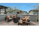 Cozy outdoor patio with comfortable seating, a fire pit table, and views of the neighborhood at 20721 W Fern Dr, Buckeye, AZ 85396