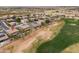 An aerial view shows a home near a green golf course at 22139 N O Sullivan Dr, Maricopa, AZ 85138