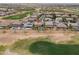 An aerial view of a home with a pool and golf course at 22139 N O Sullivan Dr, Maricopa, AZ 85138