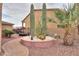 The landscaped backyard features a cactus garden with large cacti and desert plants at 22139 N O Sullivan Dr, Maricopa, AZ 85138