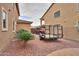 A red side-by-side and trailer sit next to the home at 22139 N O Sullivan Dr, Maricopa, AZ 85138