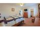 Neutral-toned bedroom featuring a mounted TV, rocking chair and walk-in closet at 22139 N O Sullivan Dr, Maricopa, AZ 85138