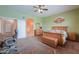 Comfortable carpeted bedroom with natural light, including a dresser and traditional wooden furniture at 22139 N O Sullivan Dr, Maricopa, AZ 85138