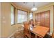 Bright dining area with natural light and ample seating with wood table and chairs at 22139 N O Sullivan Dr, Maricopa, AZ 85138