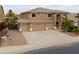 Stylish two-story home with spacious three-car garage and well-maintained desert landscaping at 22139 N O Sullivan Dr, Maricopa, AZ 85138