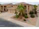 Stylish home featuring a three-car garage, desert landscaping, and a tile roof at 22139 N O Sullivan Dr, Maricopa, AZ 85138