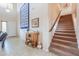 Inviting foyer with a staircase, tile floor, and tasteful decor at 22139 N O Sullivan Dr, Maricopa, AZ 85138