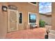 Welcoming front porch with custom door and landscaping at 22139 N O Sullivan Dr, Maricopa, AZ 85138