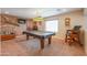 Fun game room featuring pool table, unique lighting, and mounts on the walls at 22139 N O Sullivan Dr, Maricopa, AZ 85138