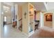 Hallway with adjacent office space and staircase leading to the upper level at 22139 N O Sullivan Dr, Maricopa, AZ 85138