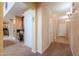 Hallway featuring an adjacent office space leading to other areas of the home at 22139 N O Sullivan Dr, Maricopa, AZ 85138