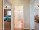 Hallway view showcases bedroom and bathroom access, bright lighting and neutral tones at 22139 N O Sullivan Dr, Maricopa, AZ 85138
