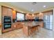 Well-equipped kitchen with stainless steel appliances, granite countertops, and a large island at 22139 N O Sullivan Dr, Maricopa, AZ 85138