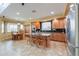 Open-concept kitchen with stainless steel appliances, granite countertops, and breakfast bar at 22139 N O Sullivan Dr, Maricopa, AZ 85138