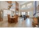 Large open-concept living room and dining area with tile floors and ample natural light at 22139 N O Sullivan Dr, Maricopa, AZ 85138