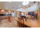 Open-concept living space features a large kitchen, dining table, and living room at 22139 N O Sullivan Dr, Maricopa, AZ 85138