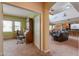 Open-concept living spaces including an office, living room, dining area, and kitchen with tile and carpet floors at 22139 N O Sullivan Dr, Maricopa, AZ 85138