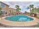 This backyard features a beautiful swimming pool with tiled accents and mature landscaping at 22139 N O Sullivan Dr, Maricopa, AZ 85138
