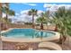 A beautiful in-ground swimming pool has coping and a metal handrail for easy access at 22139 N O Sullivan Dr, Maricopa, AZ 85138