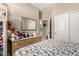 This bedroom features neutral decor, carpet, and a view of the ensuite bathroom at 23791 W Magnolia Dr, Buckeye, AZ 85326
