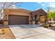 Well-maintained home featuring a two-car garage and neat landscaping at 23791 W Magnolia Dr, Buckeye, AZ 85326