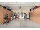 Spacious garage with plenty of storage and equipment, including storage cabinets and a walker at 23791 W Magnolia Dr, Buckeye, AZ 85326