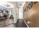 Inviting hallway with hardwood floors leading to a well-lit living space at 23791 W Magnolia Dr, Buckeye, AZ 85326