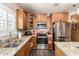 Modern kitchen with stainless steel appliances, granite countertops, and ample cabinet space for storage at 23791 W Magnolia Dr, Buckeye, AZ 85326