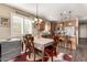 Eat-in kitchen features stainless steel appliances, ample counter space, and stylish light fixtures at 23791 W Magnolia Dr, Buckeye, AZ 85326
