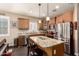 Bright eat-in kitchen boasts a large island, stainless steel appliances, and plenty of cabinet space at 23791 W Magnolia Dr, Buckeye, AZ 85326