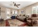 Comfortable living room with natural light, plush seating, and a view to the backyard at 23791 W Magnolia Dr, Buckeye, AZ 85326