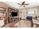 Bright living room with a large entertainment center and comfortable seating at 23791 W Magnolia Dr, Buckeye, AZ 85326