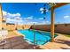 Sparkling pool featuring turquoise water, a tiled border, and a shaded pergola for outdoor relaxation and enjoyment at 23791 W Magnolia Dr, Buckeye, AZ 85326