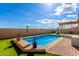 Beautiful pool with landscaping offering a private oasis and outdoor relaxation with a well-maintained backyard at 23791 W Magnolia Dr, Buckeye, AZ 85326