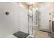 A clean and bright walk-in shower has built-in seating and sleek fixtures at 23791 W Magnolia Dr, Buckeye, AZ 85326