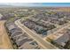 An aerial view of a modern community with beautiful homes, green spaces, and streetscapes at 24878 N 172Nd Dr, Surprise, AZ 85387