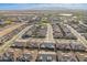 Wide aerial view featuring the community's harmonious design, and serene lakes against a mountain backdrop at 24878 N 172Nd Dr, Surprise, AZ 85387