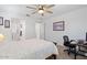 Bright bedroom featuring an ensuite bathroom and a desk for a private and functional space at 24878 N 172Nd Dr, Surprise, AZ 85387