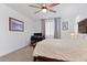 Comfortable bedroom with a ceiling fan and natural light, perfect for relaxation and rest at 24878 N 172Nd Dr, Surprise, AZ 85387