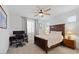 Cozy bedroom with a comfortable bed, desk, and nightstand for a functional and relaxing space at 24878 N 172Nd Dr, Surprise, AZ 85387