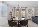 Charming dining area featuring a round table with backyard views through sliding glass doors at 24878 N 172Nd Dr, Surprise, AZ 85387